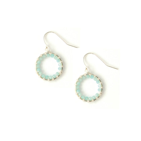 A pair of silver-toned drop earrings featuring open circular hoops bordered with small light blue-green beads, suspended from silver-toned fishhook wires on a plain white background.