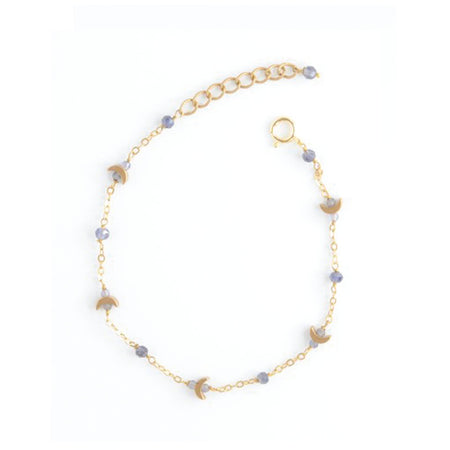 A delicate gold chain bracelet with small faceted lavender beads and crescent moon charms, displayed on a clean white background.