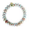 Pale blue Shoushan gemstone rondelle bracelet with red accent beads on a white background.”